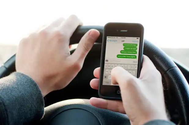Using A Hand-Held Mobile Phone
