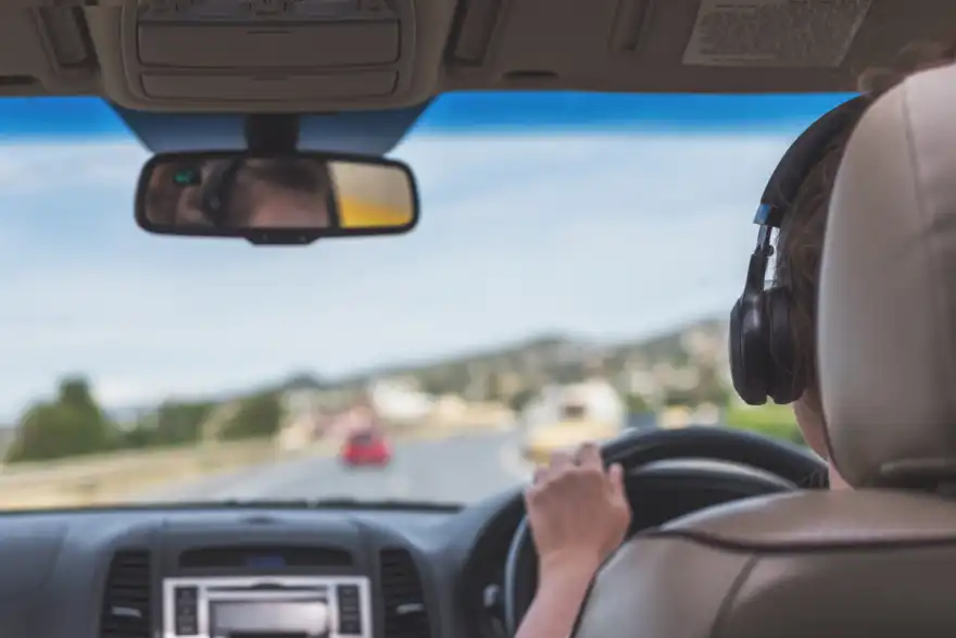 Wearing headphones while driving