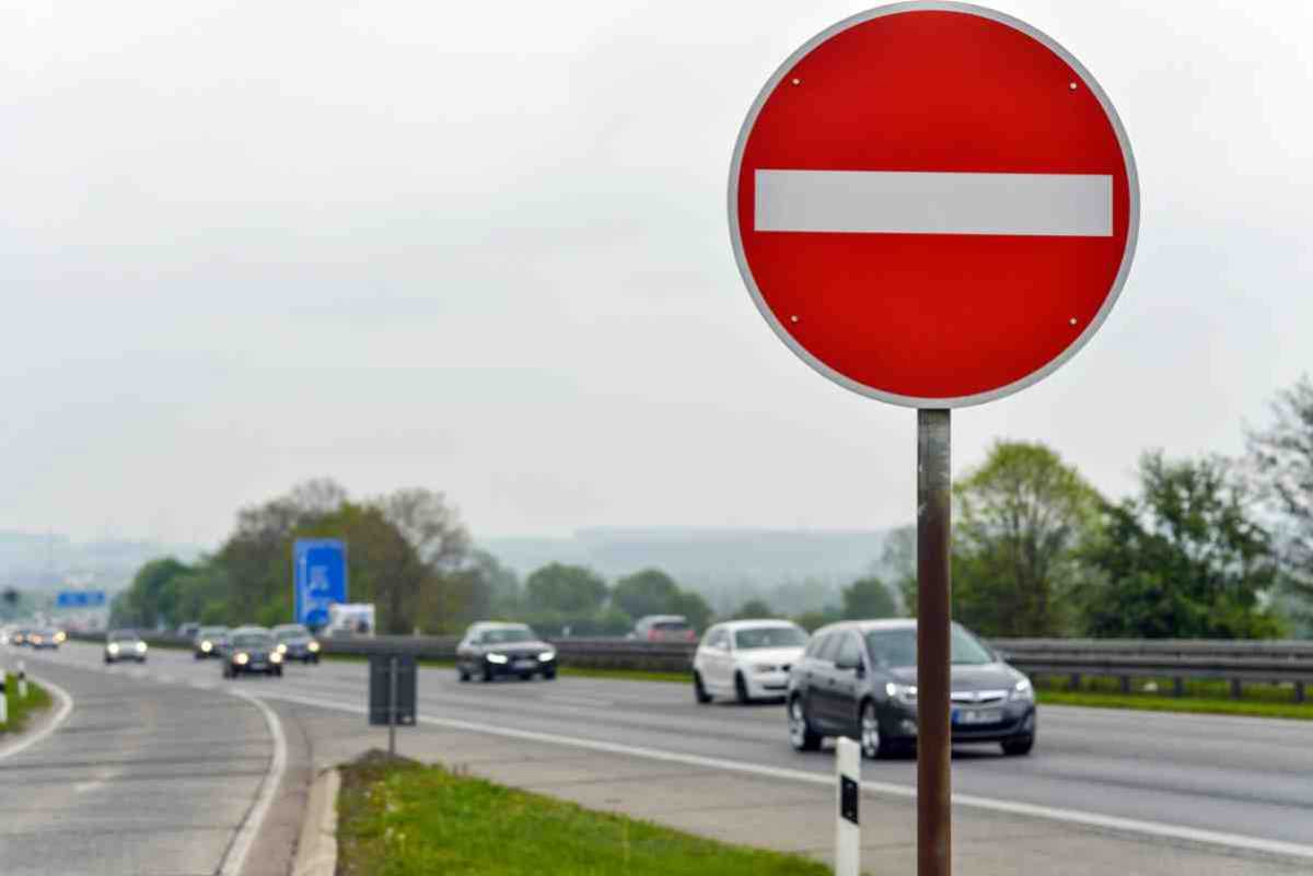 Multiple motorists perform shocking U-turn and drive the WRONG way up busy slip road to avoid traffic jam