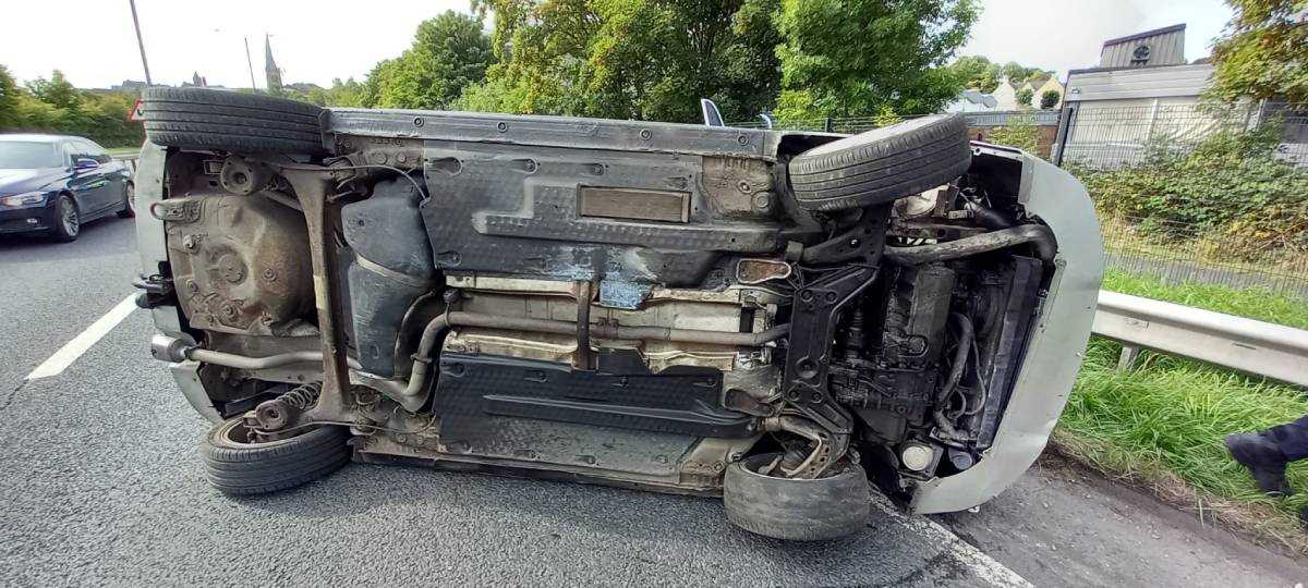 Careless driver flips car on busy road just moments after buying it