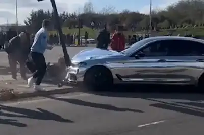 Idiot crashes into onlookers whilst trying to drift
