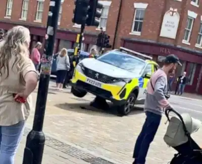 Police get their patrol car stuck on a bollard after a wrong turn into a pedestrianised area