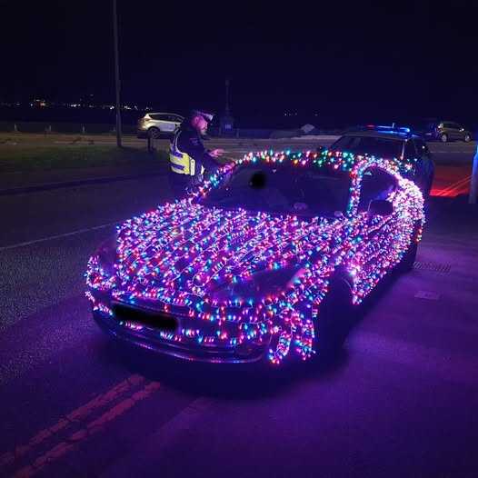 Festive Driver Pulled Over After Covering Car in Christmas Lights