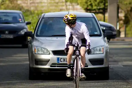 Cyclists! Why do they ride in the middle of the road?