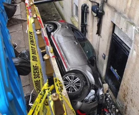 You can’t park there sir! Man arrested after car became wedged against basement of historic hotel